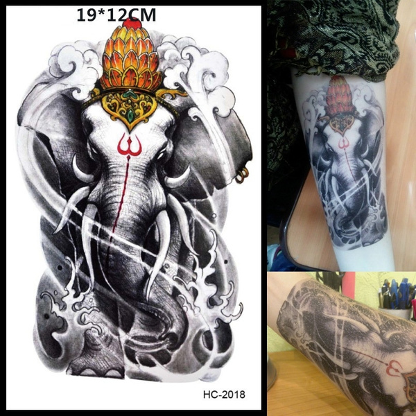 Tiny fine line style elephant tattoo on the left thigh,