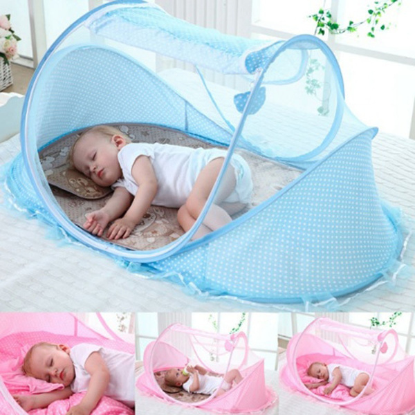 Baby sleeping on sale mosquito net