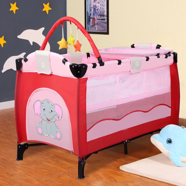 pink playpen with bassinet