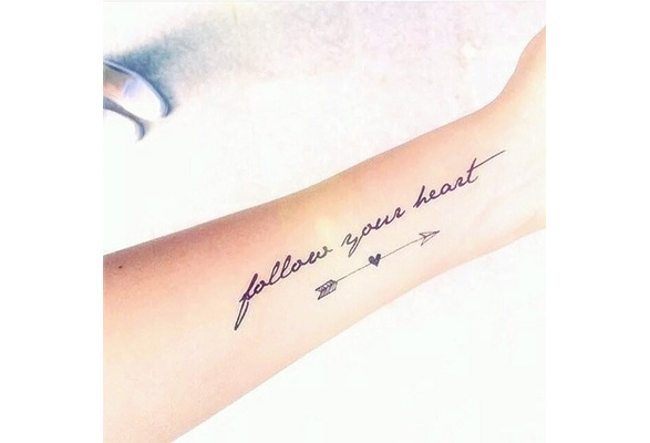 Follow your heart lettering tattoo located on the