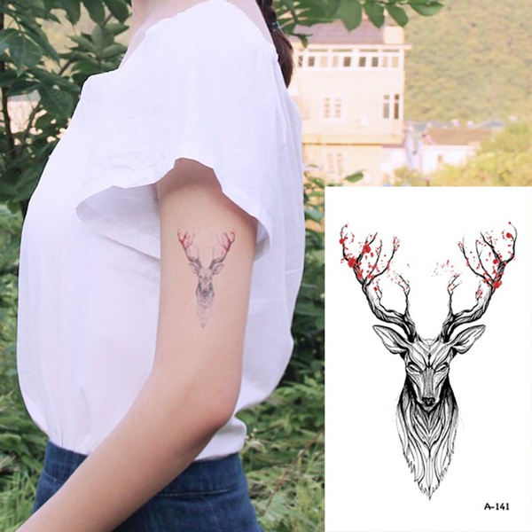 Forearm tattoo of a deer by Murat Bilek.