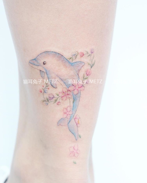 Tattoo uploaded by @svyat.nes • she really loves dolphins, okay, whatever.  • Tattoodo