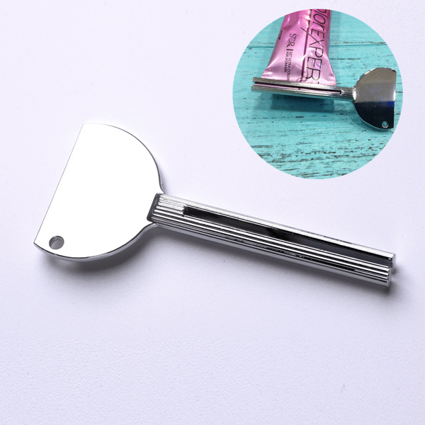 1 presse-tube en acier inoxydable pour tube de dentifrice.
