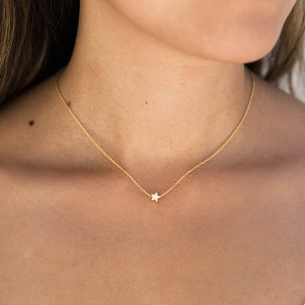 Tiny gold on sale star necklace