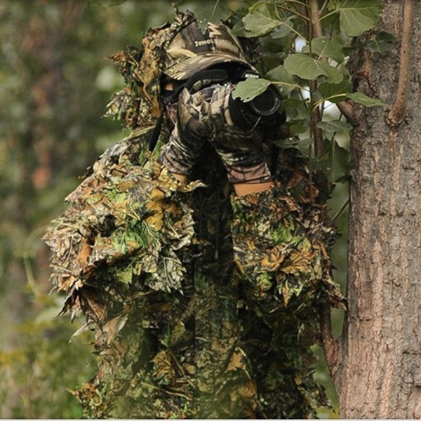 Soldier in the forest with a machine gun. War concept, Ghillie suit sniper  camouflage sitting on a jungle, AI Generated 32546340 Stock Photo at  Vecteezy
