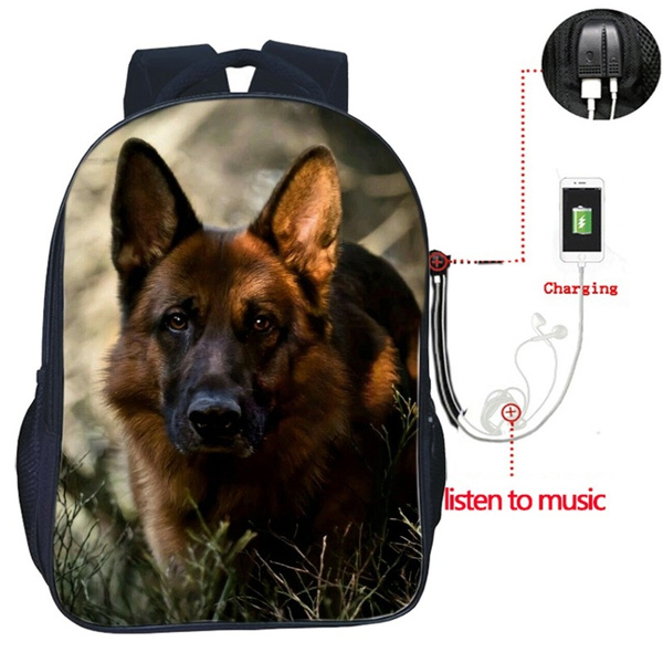 german shepherd in backpack