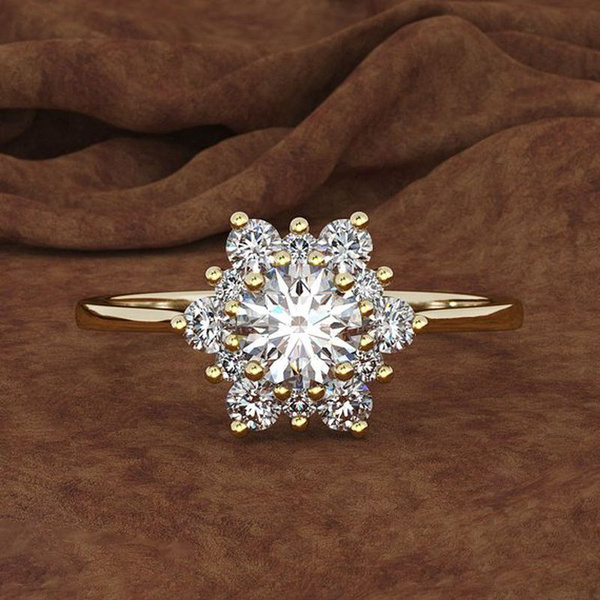 gold diamond ring on finger