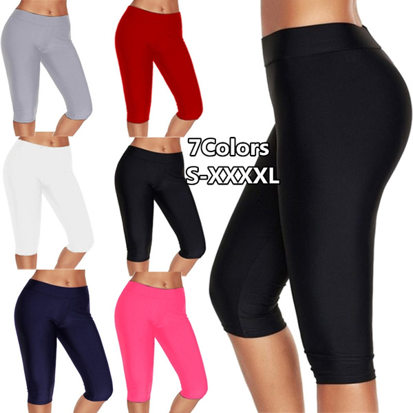 Knee-length tights shorts for women. Slim running leggings