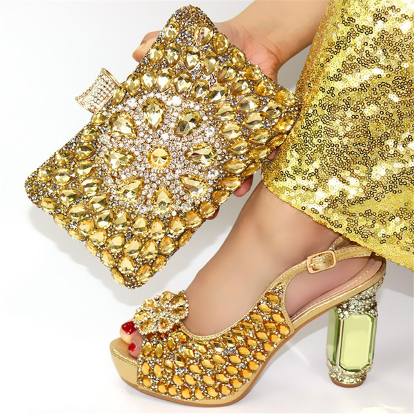 gold sandals and matching bag