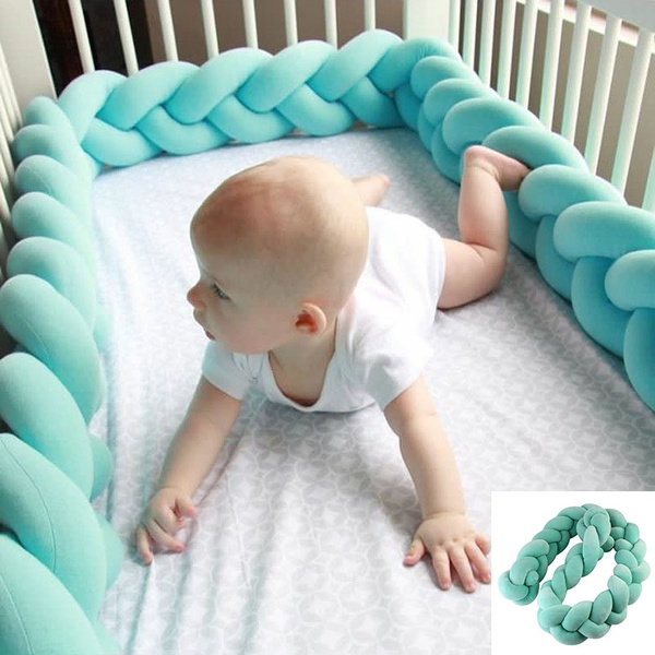 pillow around crib