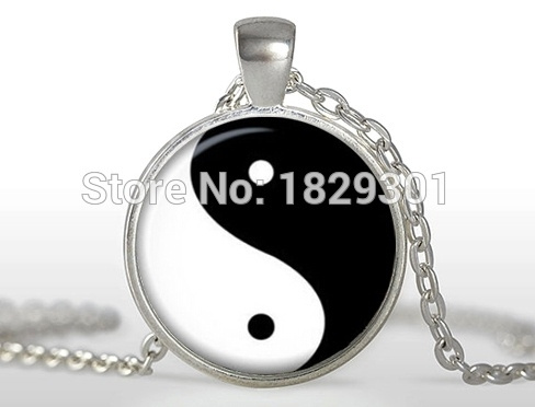 dome glass necklace with yin and yang symbol