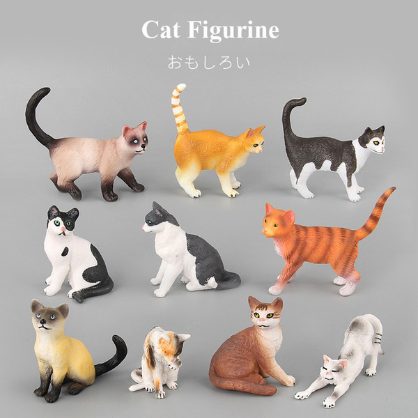 small plastic cat figures