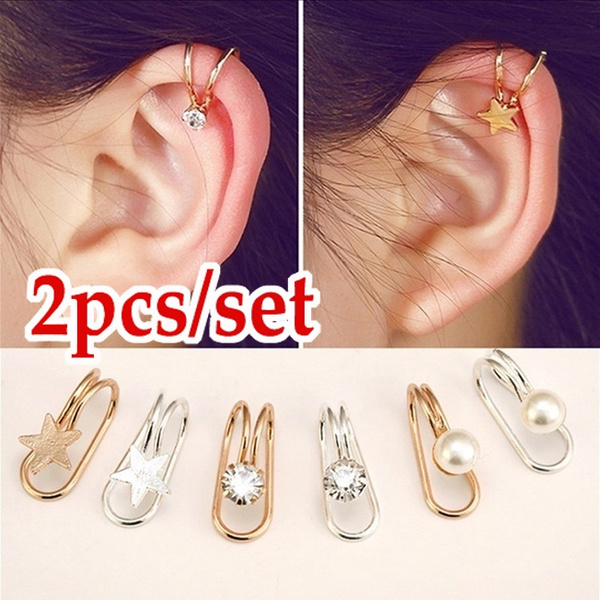 Premium AI Image | two earrings with a bird on the left side.