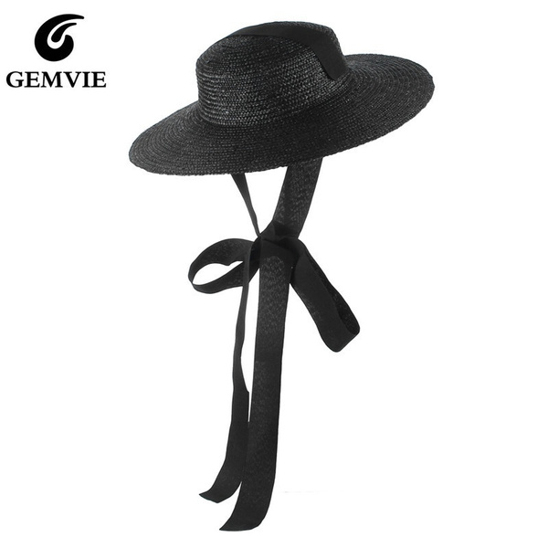 straw hat with black ribbon tie