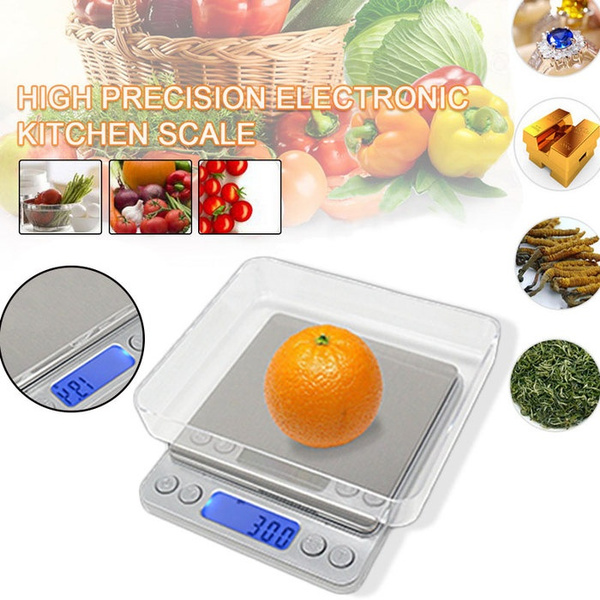 Weighing an Apple Fruit on a Digital Kitchen Scale in Grams on