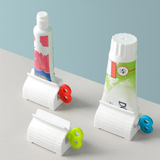 Convenient Toothpaste Dispenser Rolling Toothpaste Squeezer Stand Holder Bathroom Accessories