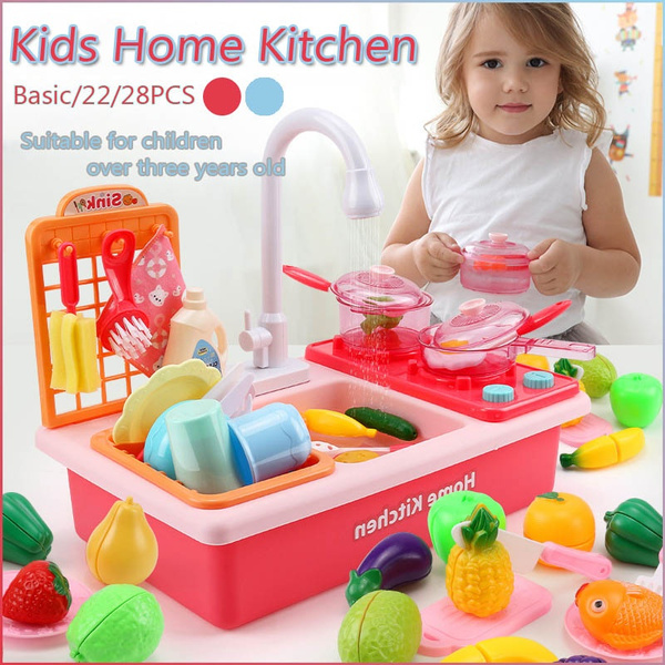 playing with kitchen toys
