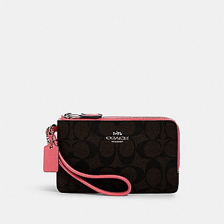 brown and pink coach wristlet