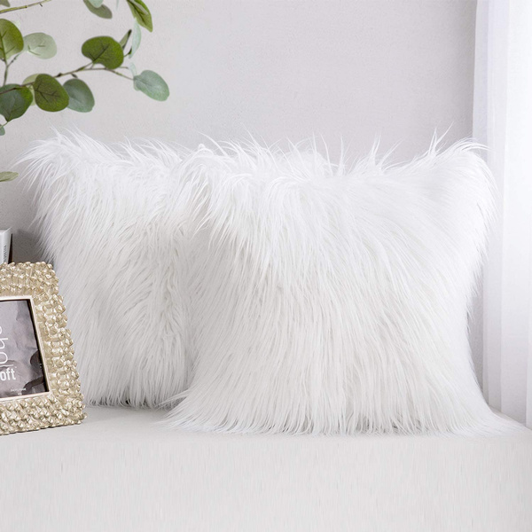 White faux outlet fur pillows