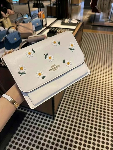 white coach clutch