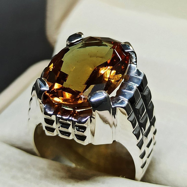 Woman wearing a big diamond ring and golden bracelets Stock Photo - Alamy