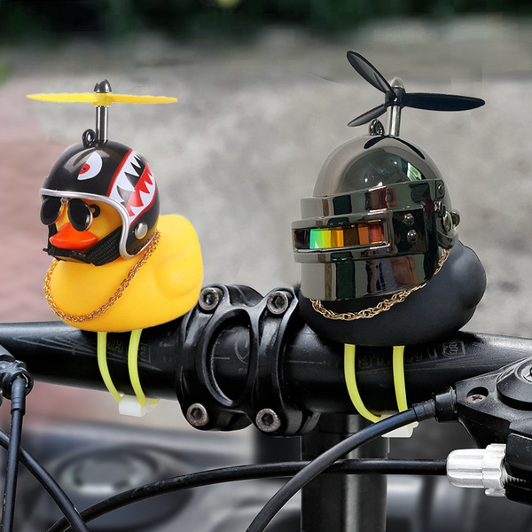 Little yellow duck little black duck wearing helmet car exterior ...