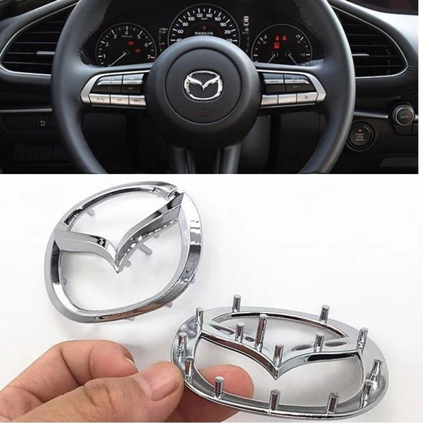 2010 mazda 3 steering wheel emblem replacement